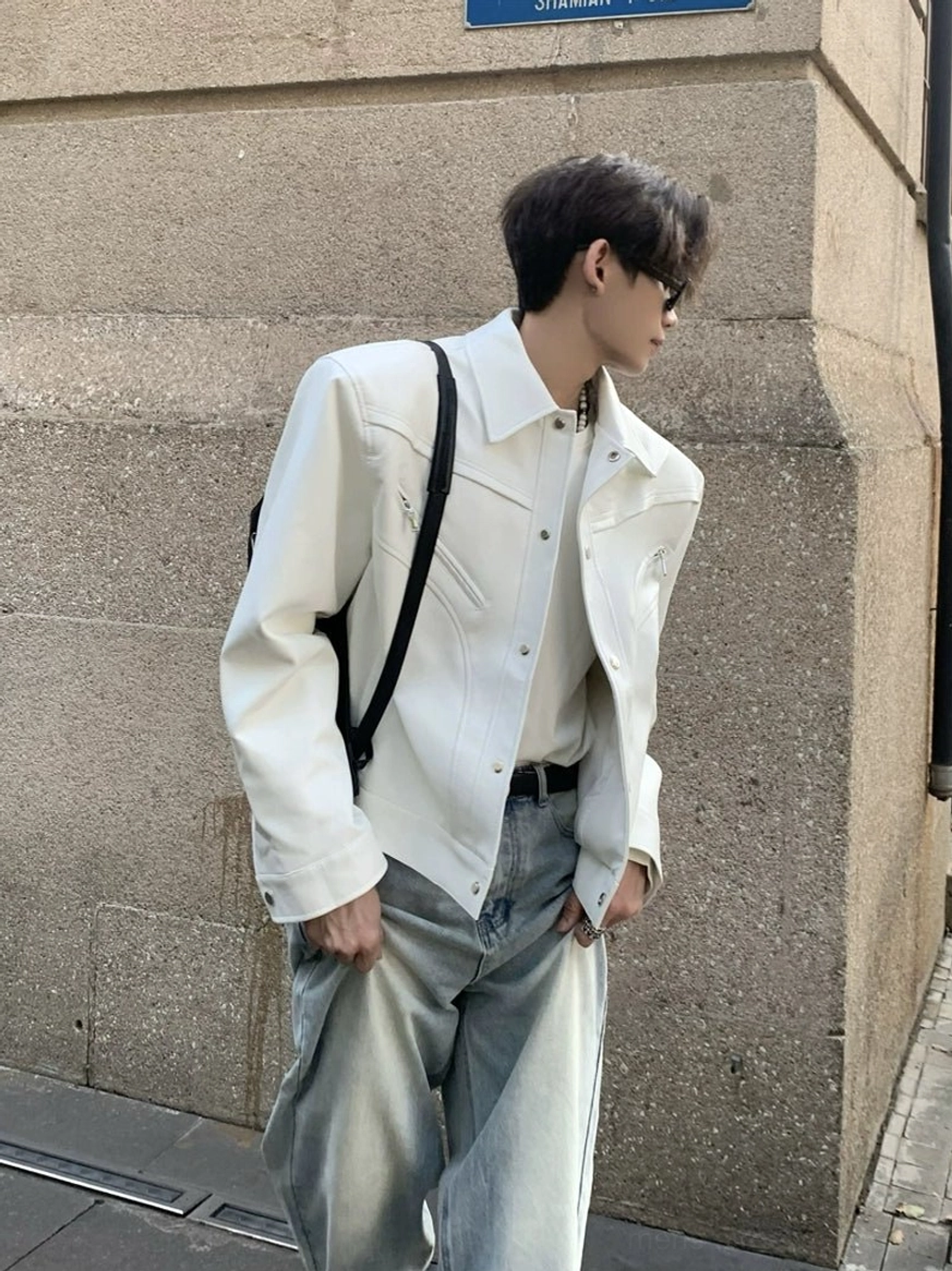 Off-white wide-shoulder cropped denim jacket styled with light blue jeans and white sneakers in a modern Seoul streetwear outfit