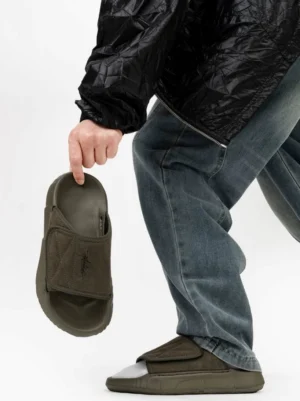 Olive green suede-style adjustable velcro platform slides with chunky sole shown from side and overhead streetwear view