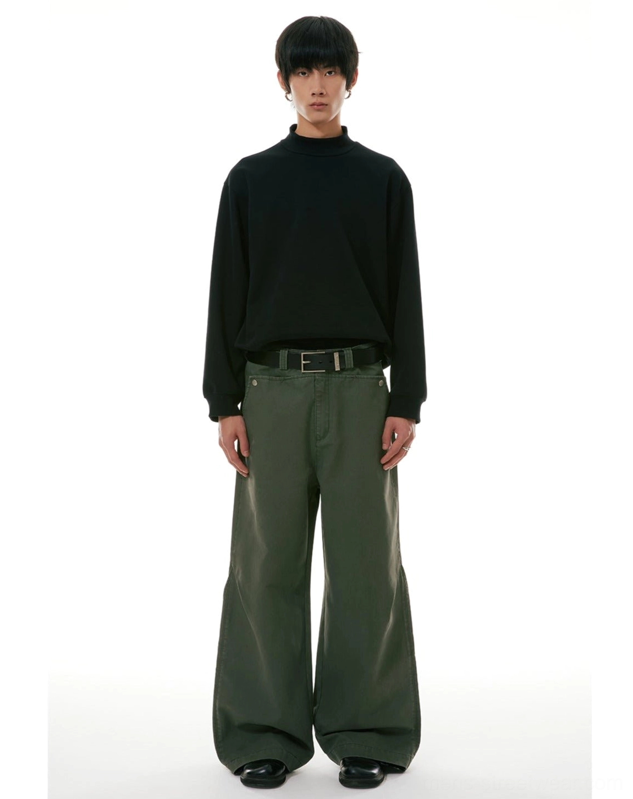 Front full-body view of high-waisted olive green wide-leg workwear denim jeans with classic pockets and leather belt styling