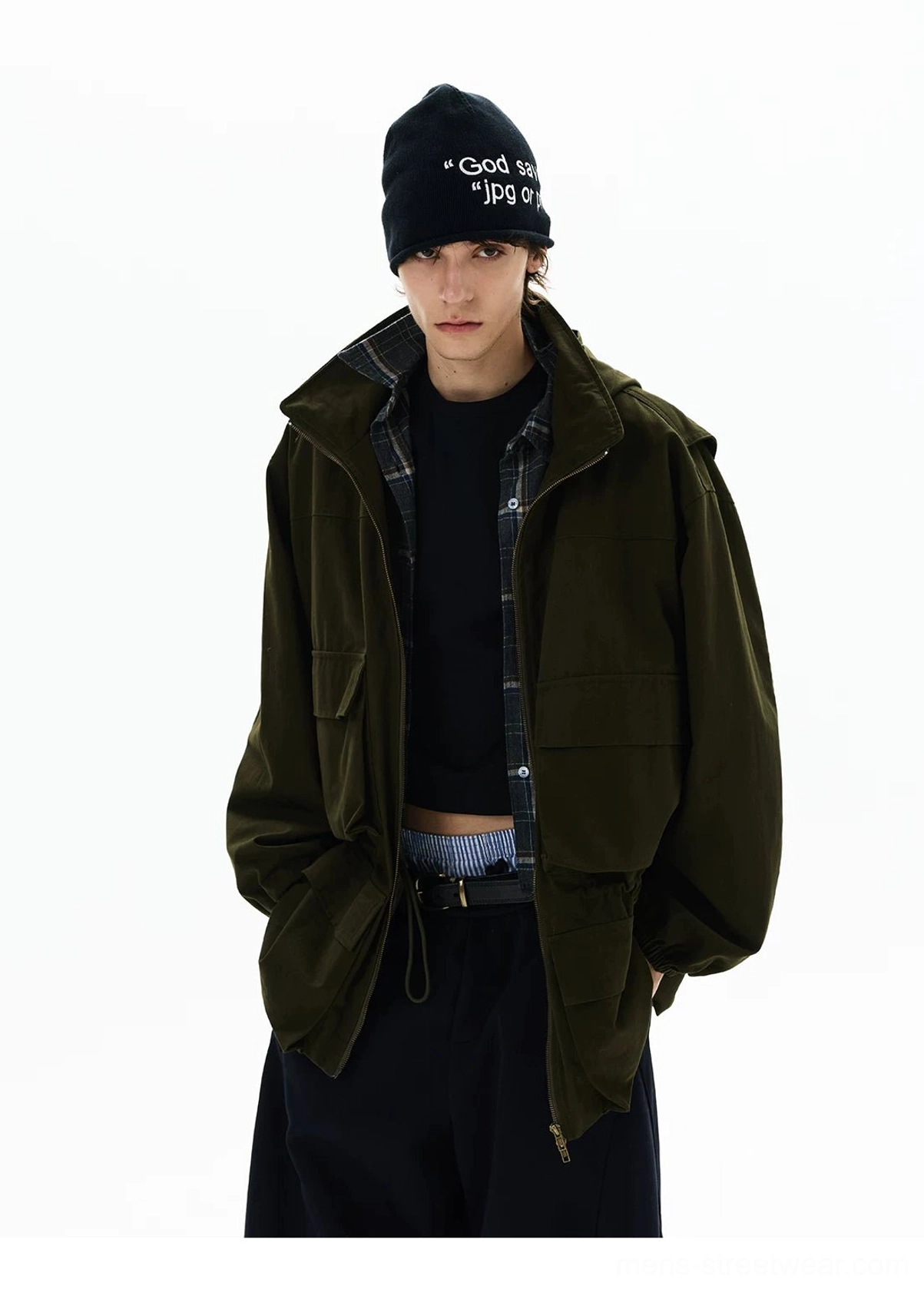 Front view of olive green Korean streetwear parka with hands in pockets, cropped layered top, plaid collar lining, and wide-leg trousers