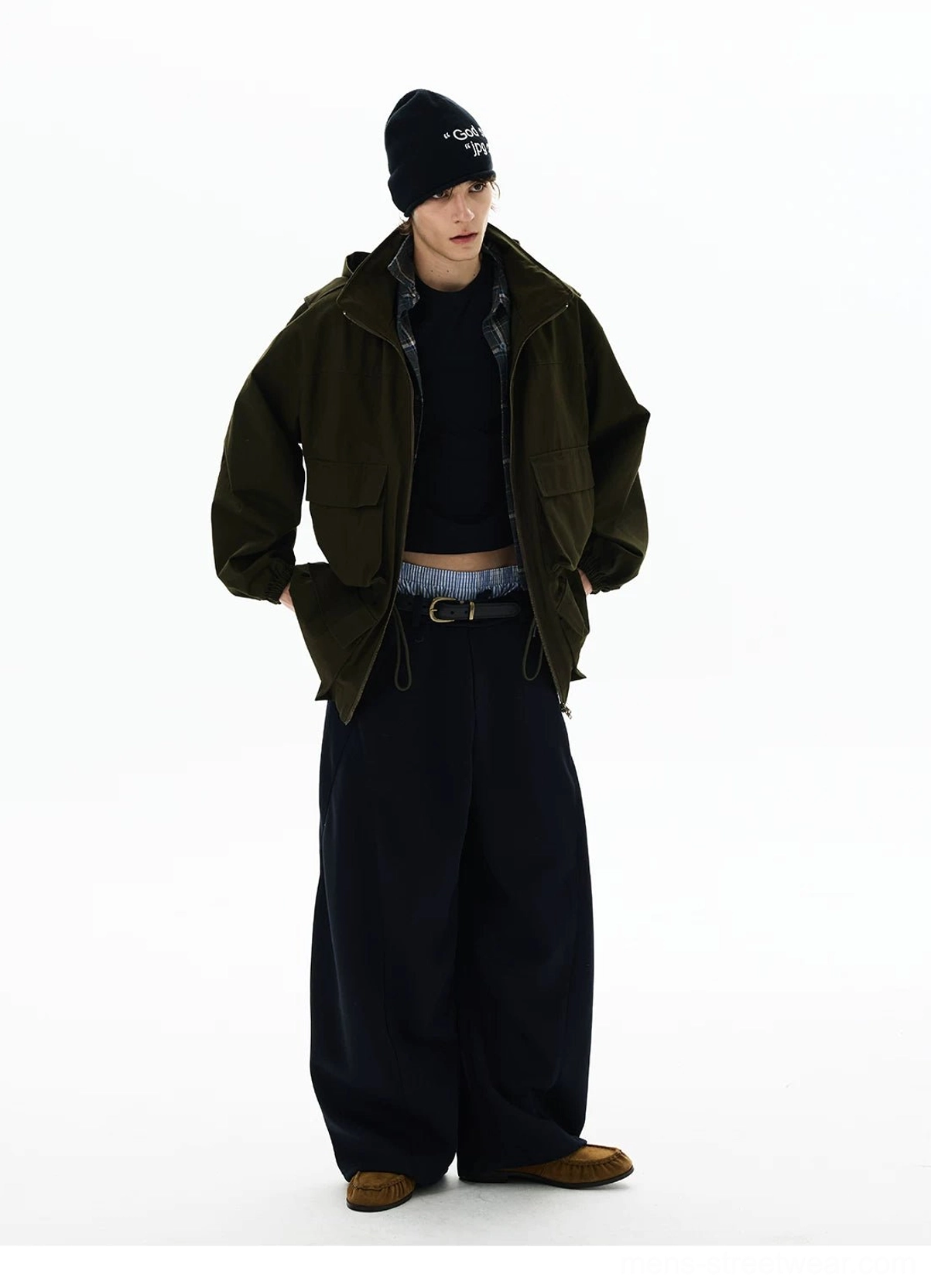 Olive green minimalist utility parka with relaxed silhouette, front pockets, high collar, and neutral Korean streetwear outfit