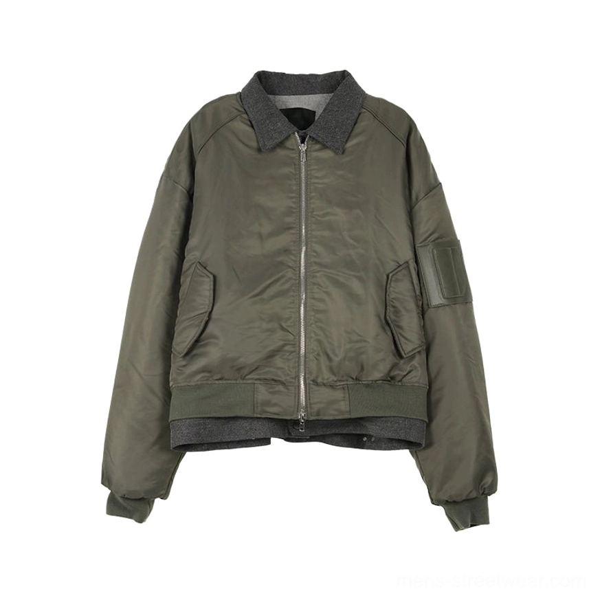 Olive green oversized contrast trim zip bomber jacket flat lay showing grey ribbed collar faux layered hem and utility sleeve pocket
