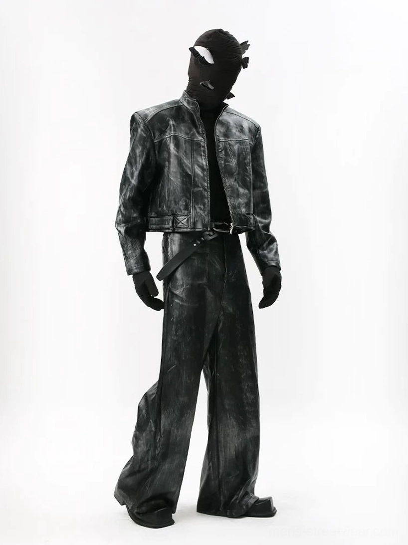 Black distressed coated wide-leg trousers styled with a matching cropped biker jacket for a dark Seoul streetwear outfit