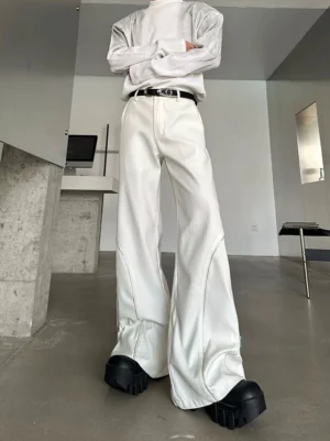 Off-white Orbit Sculpt wide-leg zip trousers shown from a low-angle front view with curved side seams, silver zipper trim, high waist, and ultra-long draped legs over chunky footwear