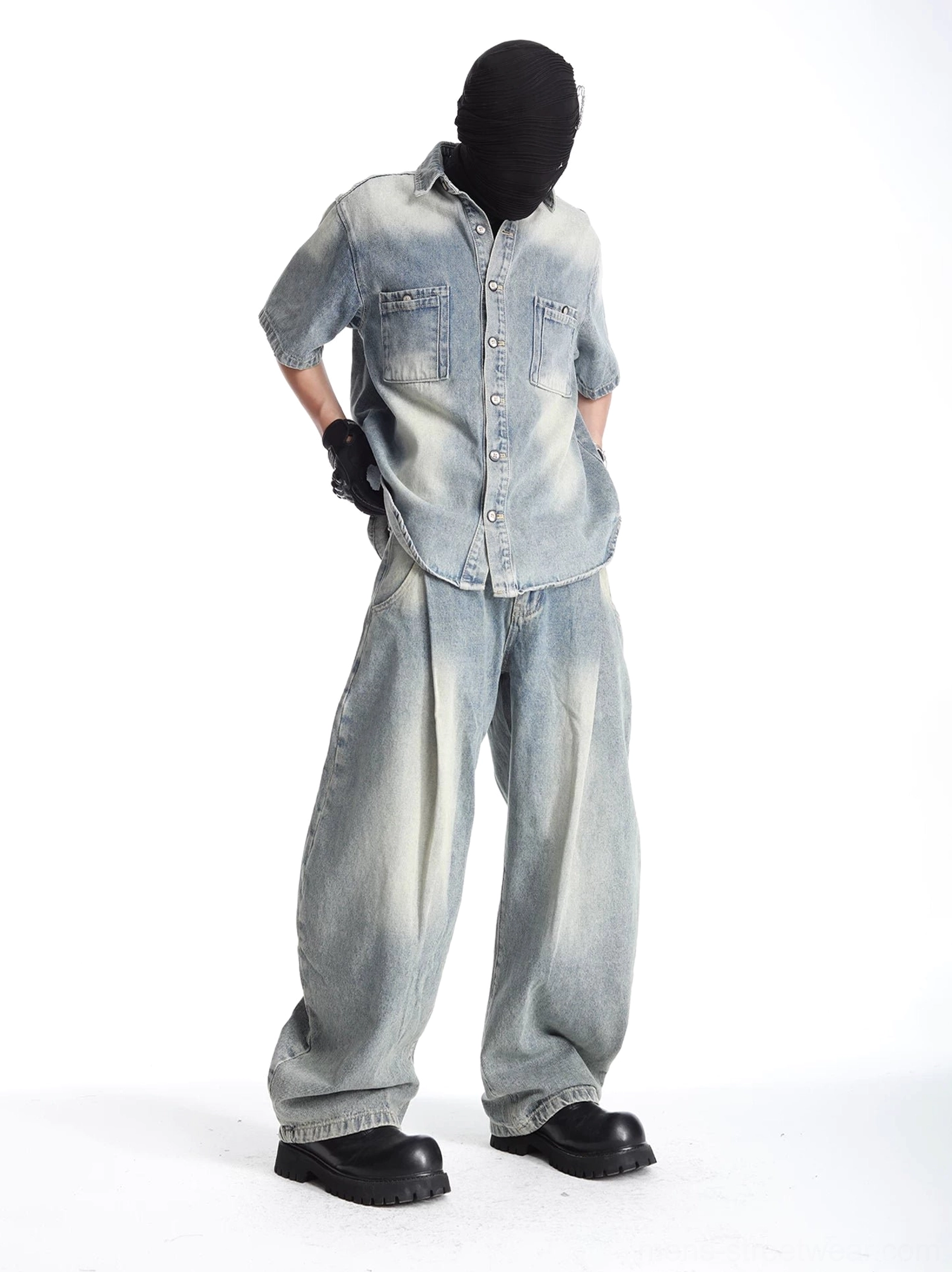 Side view of oversized acid-washed short-sleeve denim shirt with matching baggy jeans and relaxed East Asian streetwear silhouette