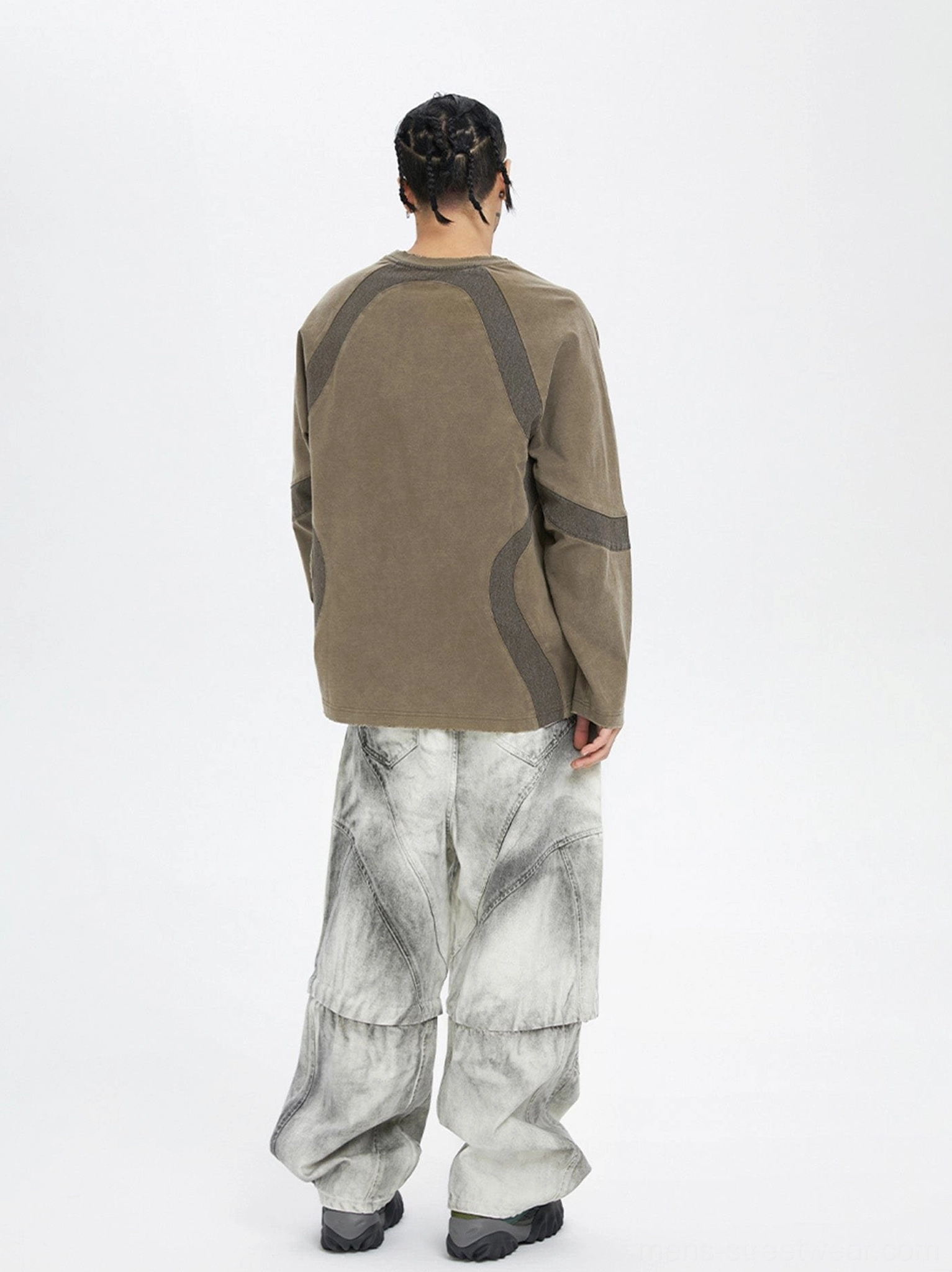 Full back view of oversized ash grey moto convertible cargo pants with coordinated paneled construction and relaxed streetwear fit