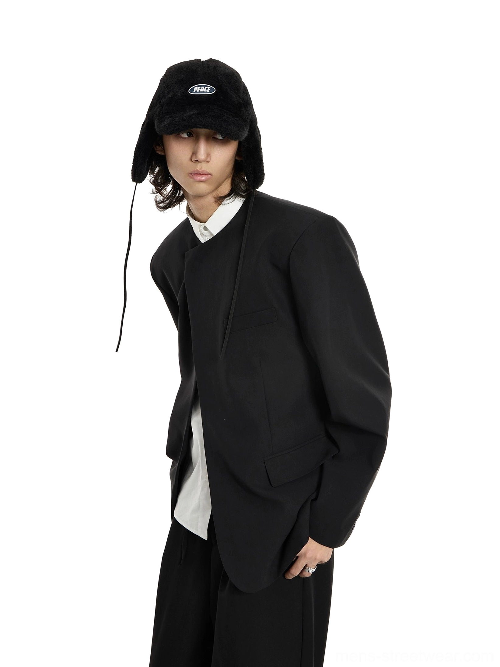 Oversized black collarless structured blazer in Korean streetwear styling, three-quarter front view