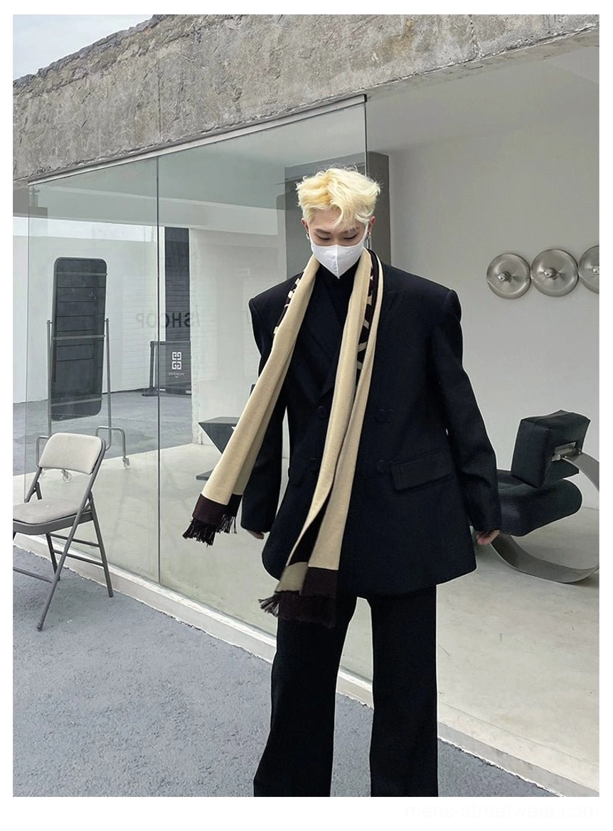 Full-length oversized black double-breasted blazer outfit styled with matching trousers and a long neutral scarf