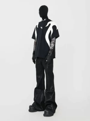 Rear view of an oversized black cotton flame graphic T-shirt showing full off-white back flame appliques with relaxed Korean streetwear styling and wide-leg leather pants