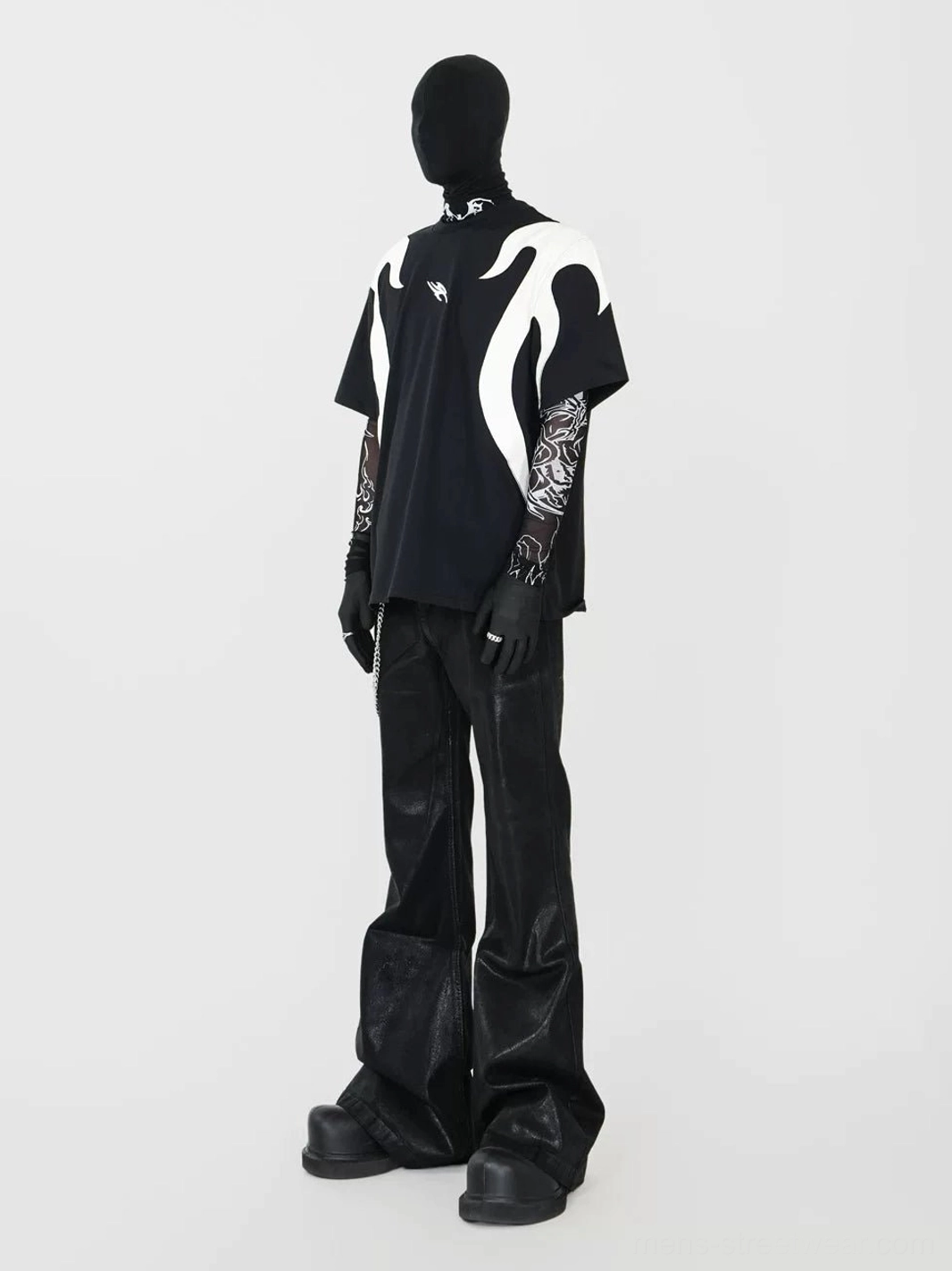 Rear view of an oversized black cotton flame graphic T-shirt showing full off-white back flame appliques with relaxed Korean streetwear styling and wide-leg leather pants