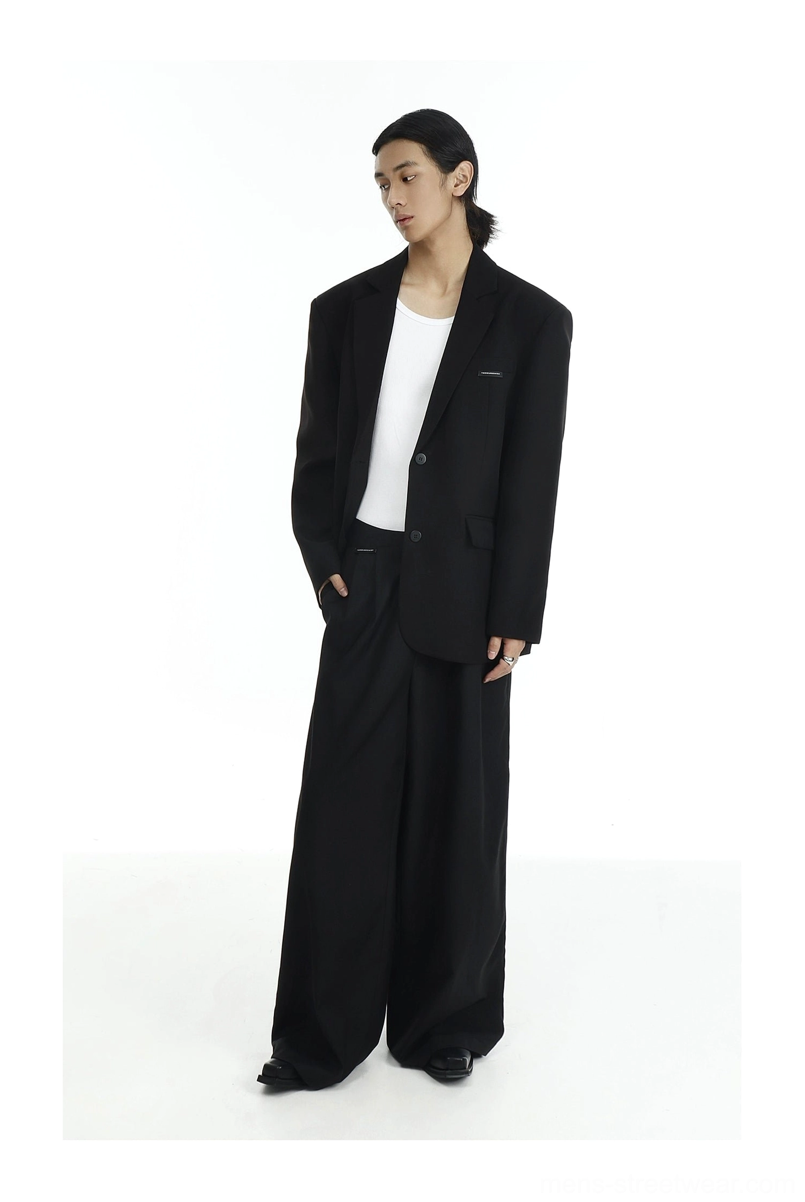 Oversized black tailored blazer and flowy wide-leg trousers with white T-shirt in Korean minimalist fashion