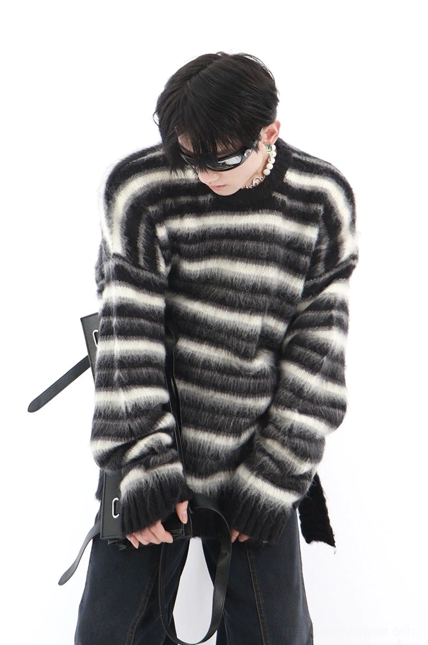 Oversized black and white striped mohair blend sweater front three quarter view with fuzzy brushed knit texture