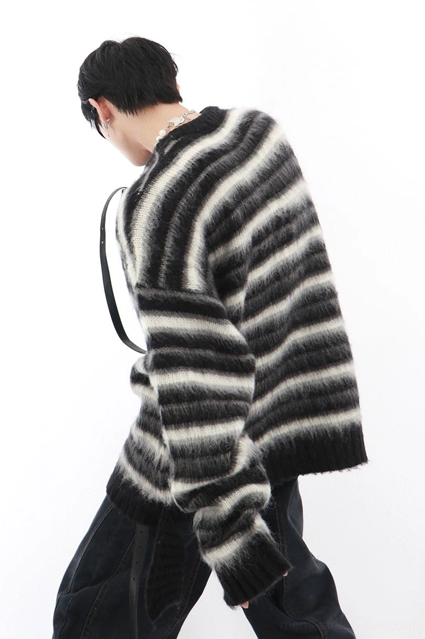 Black and white striped oversized mohair blend sweater rear side view showing relaxed drop shoulder silhouette and ribbed hem