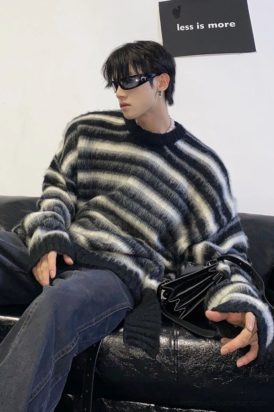 Oversized striped mohair blend sweater seated front side view highlighting soft fuzzy knit drape and relaxed fit