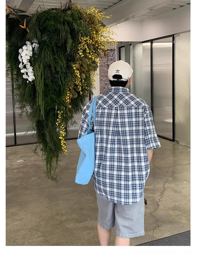 Back view of oversized blue and white plaid Korean streetwear shirt showing full plaid pattern and loose fit