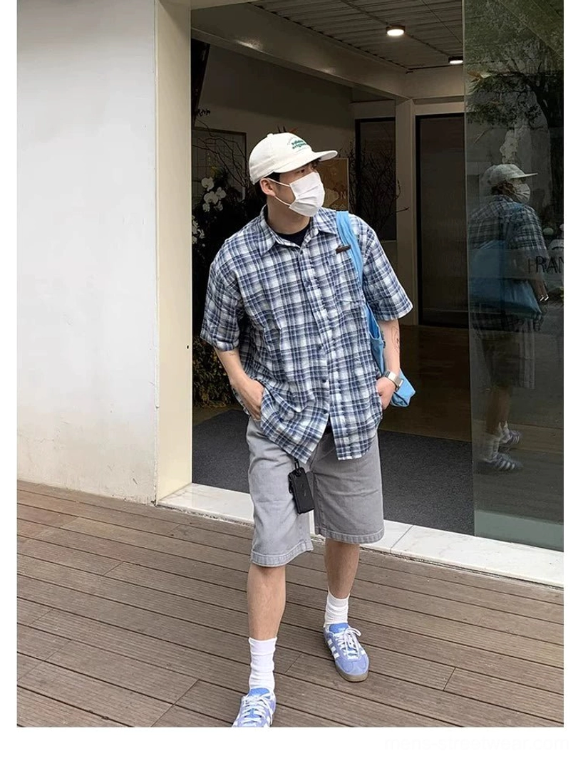 Three quarter view of relaxed oversized blue white plaid button up shirt for Korean streetwear outfits