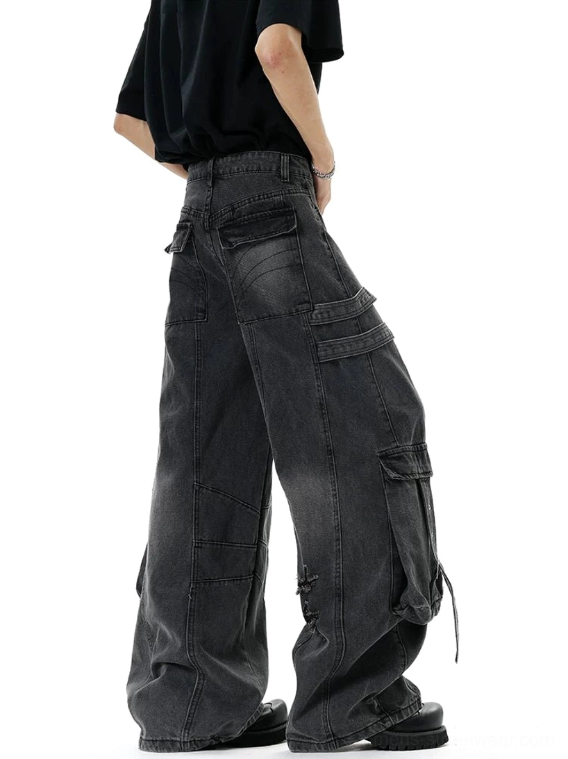 Oversized cargo denim jeans with wide baggy legs, deconstructed distressed finish, adjustable straps, and modern Asian streetwear aesthetic