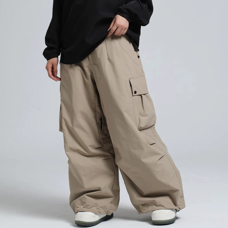 Khaki tan wide-leg cargo snow pants with minimalist streetwear silhouette and flap pocket