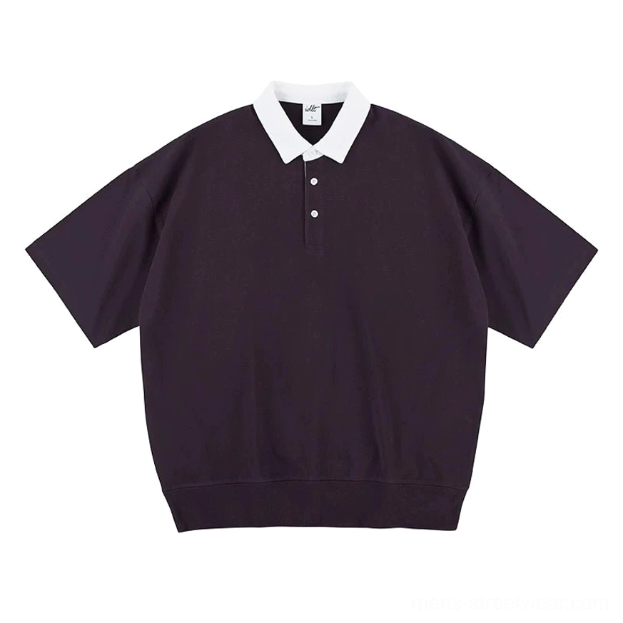 Relaxed oversized contrast collar polo shirt showing dropped shoulders wide sleeves and ribbed bottom hem