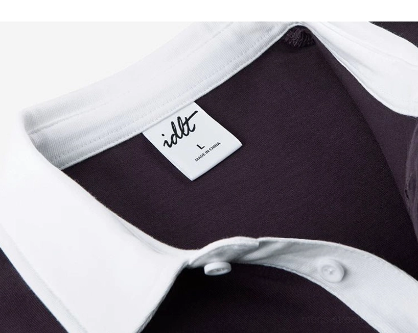 Oversized cotton knit polo shirt with white contrast collar dark solid body and ribbed hem
