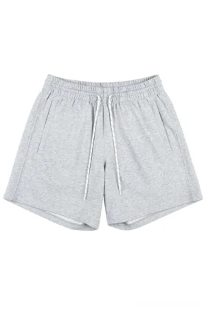 Heather gray oversized cotton sweat shorts with elastic drawstring waistband and side pockets on a white background