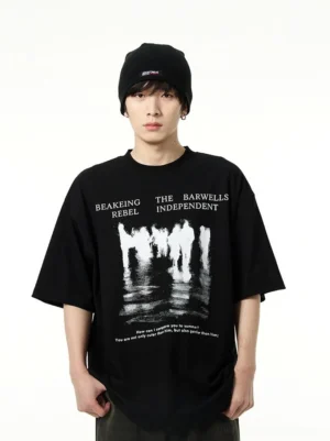 Black oversized crowd reflection graphic cotton streetwear T-shirt front close-up on male model