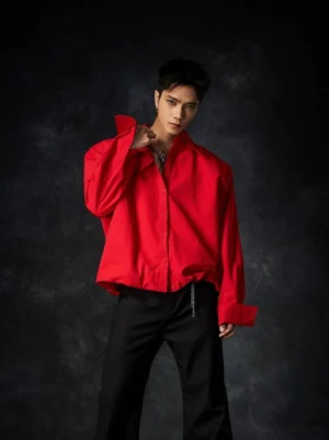 Bright red oversized draped poplin shirt styled with black wide-leg trousers in a Korean streetwear studio look