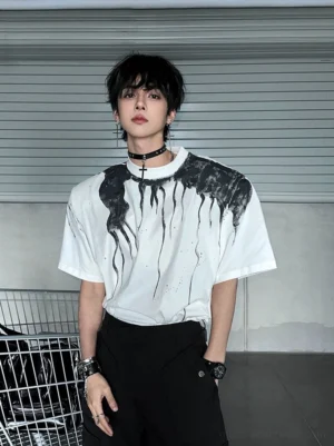 White oversized drip print T-shirt with black dripping graphic styled as a Korean streetwear outfit
