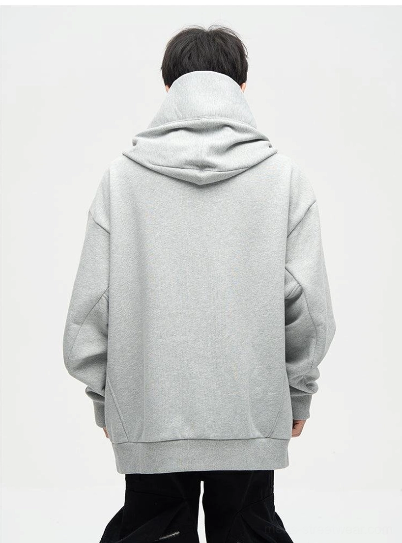 Gray oversized dual-layer hoodie back view showing clean minimalist paneling ribbed hem and relaxed drop-shoulder fit