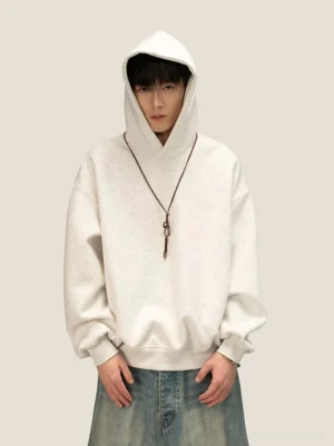Oversized off-white heathered fleece hoodie with roomy drawstring hood and relaxed Korean streetwear fit