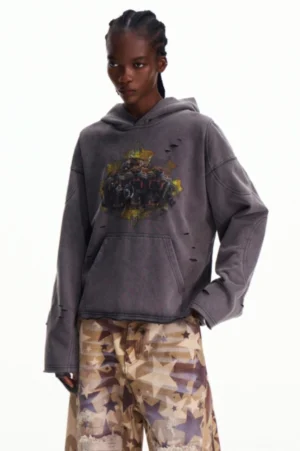 Three-quarter front view of an oversized faded gray graphic hoodie with relaxed drop shoulders, distressed texture, and devil horn hood details