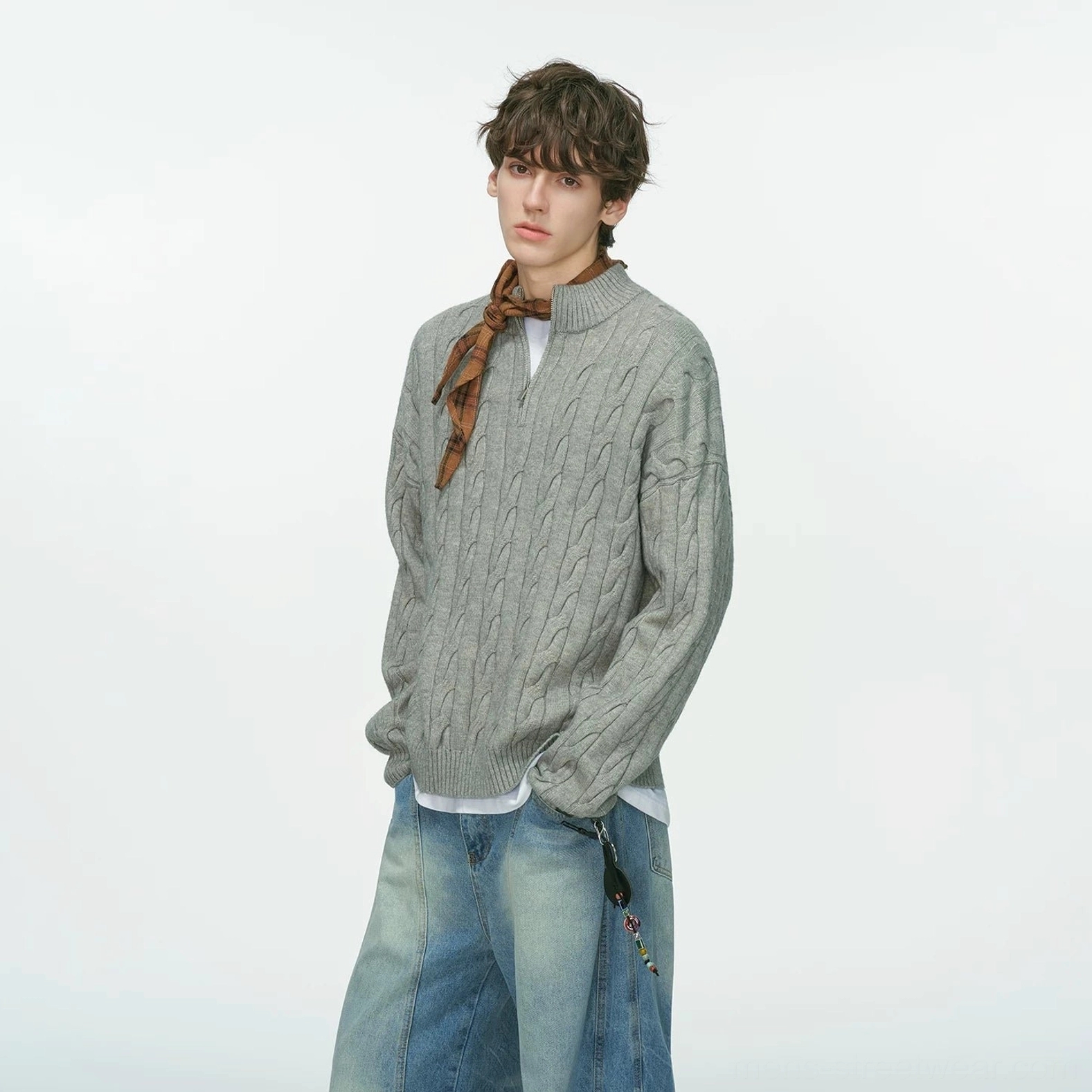 Oversized half-zip cable-knit sweater suitable for layering over shirts, tees and relaxed wide-leg trousers