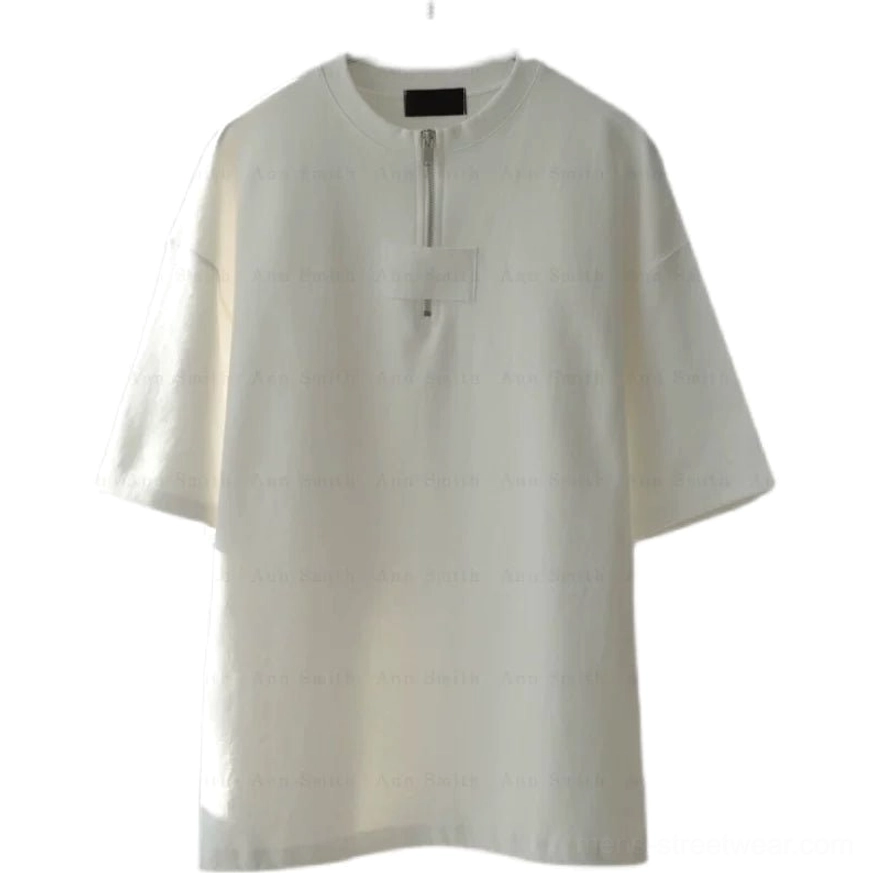 Flat lay front view of light oversized half-zip cotton tee with dropped shoulders and utility chest panel