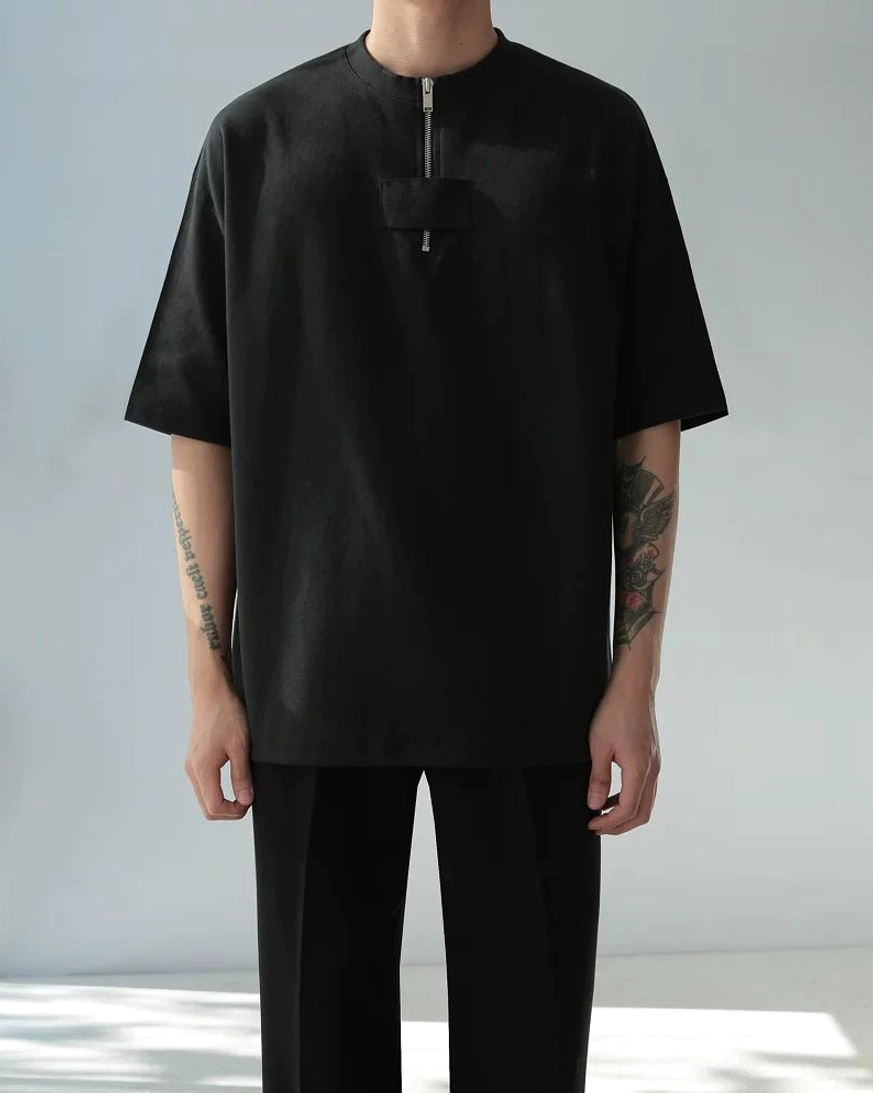 Oversized half-zip cotton tee utility chest panel product detail view for minimalist streetwear styling