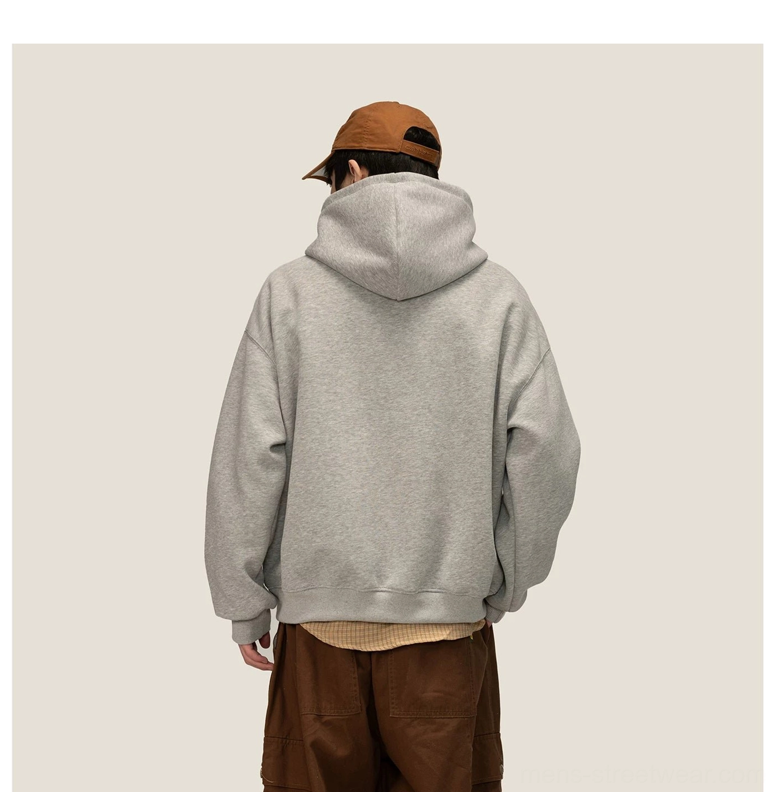 Back view of oversized heather gray fleece hoodie showing roomy hood and ribbed hem construction