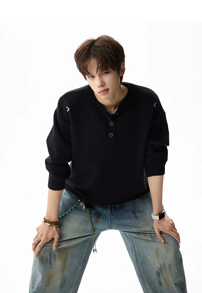 Oversized henley knit sweater product view featuring a relaxed streetwear silhouette, ribbed trims, and casual layered styling