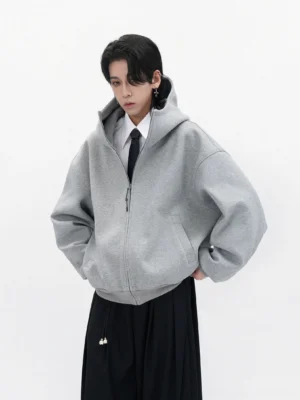 Heather gray oversized full-zip hoodie styled with a white shirt black tie and wide-leg trousers in a minimalist Seoul streetwear outfit