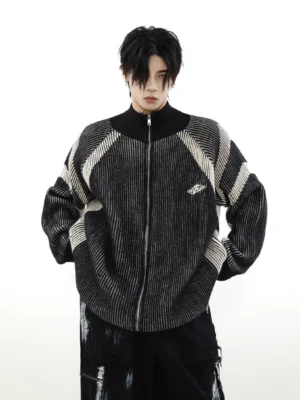 Black oversized high-neck striped knit zip cardigan with geometric contrast details and chest embroidery on male model