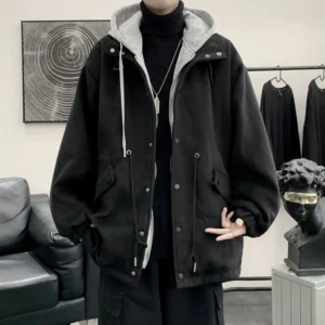 Black oversized hooded utility jacket styled over a black turtleneck in a Korean streetwear outfit