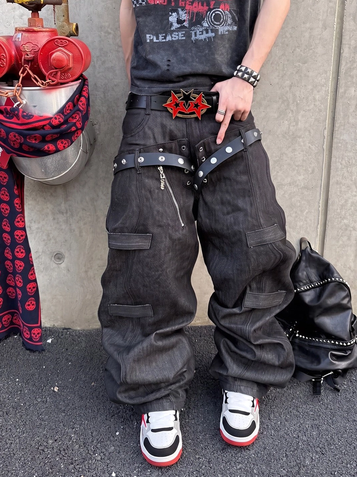 Front view of oversized letter court sneakers paired with baggy streetwear trousers