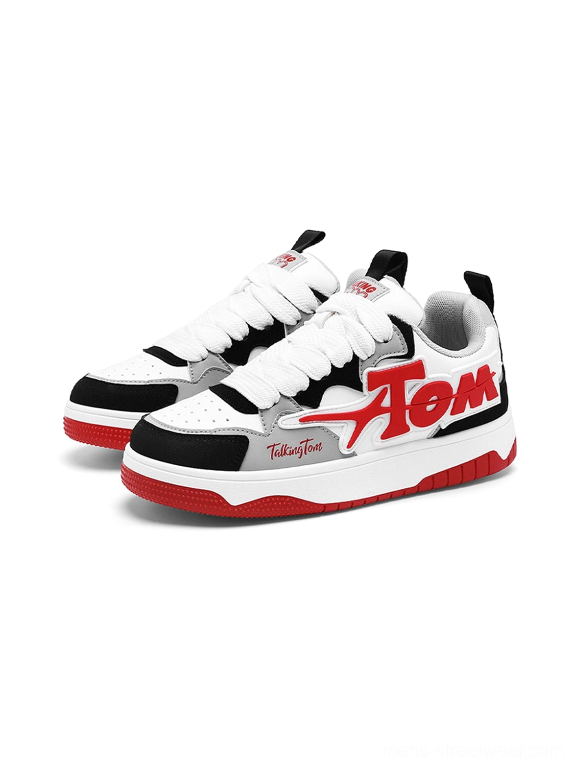 Pair of red black and white oversized letter colorblock court sneakers in three quarter view