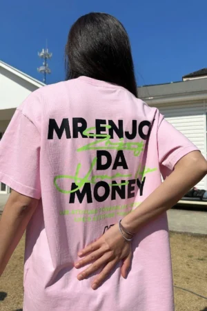 Pink oversized logo graphic cotton T-shirt back view with neon green and black streetwear typography print
