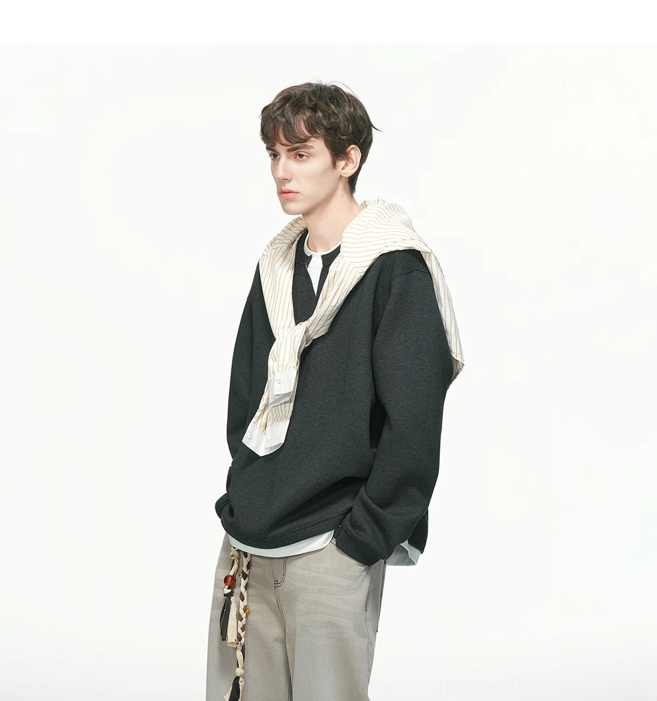 Oversized men's crew neck sweatshirt with faux layered hem, soft structured fabric, and contemporary Acubi streetwear proportions