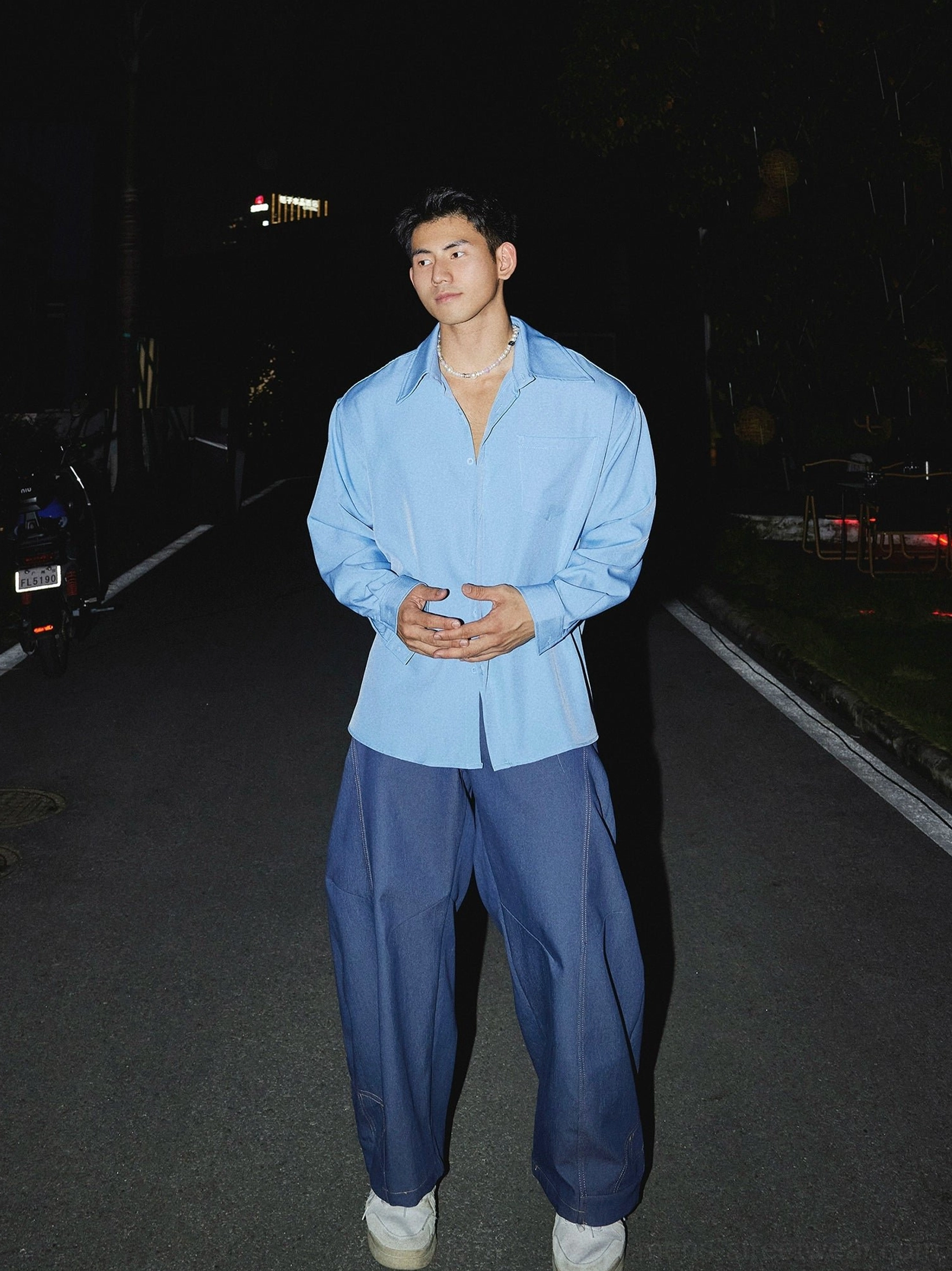 Oversized men's streetwear dress shirt featuring long sleeves button front pointed collar and relaxed urban fit
