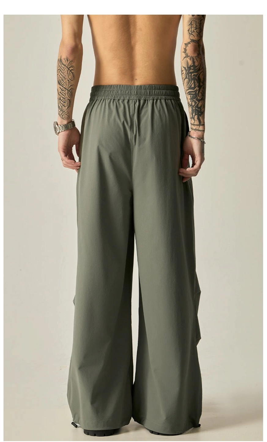 Oversized men's wide leg pants with elastic drawstring waist and adjustable hems in versatile black and gray green colors