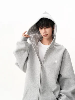 Heather gray oversized full-zip streetwear hoodie with hood up, patterned lining and embroidered chest detail