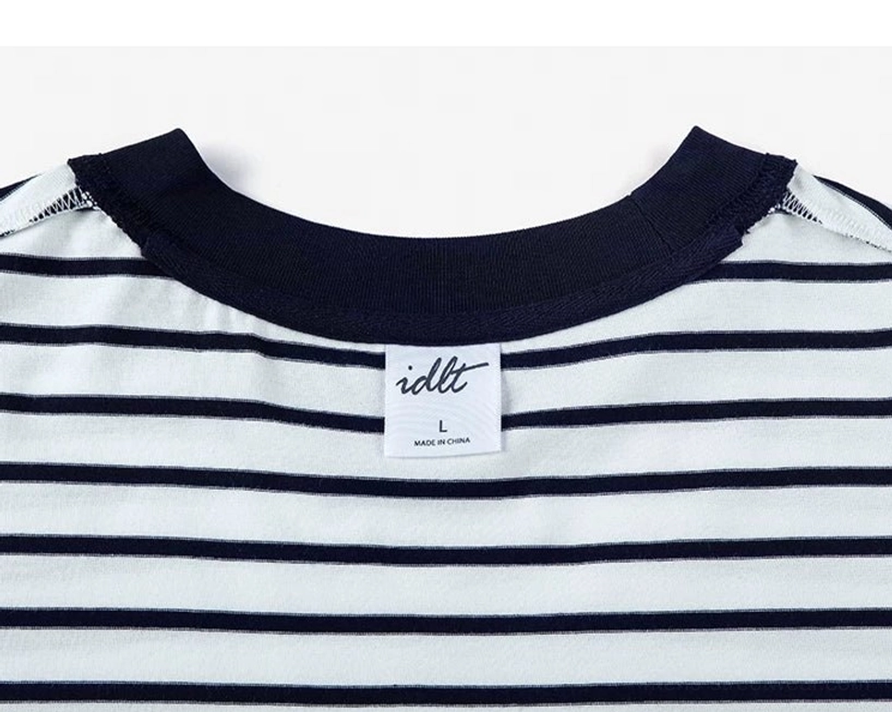 Back neck collar detail of dark blue striped oversized cotton streetwear T-shirt