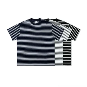 Oversized nautical stripe cotton streetwear T-shirts in navy white and black white horizontal stripe colorways flat lay