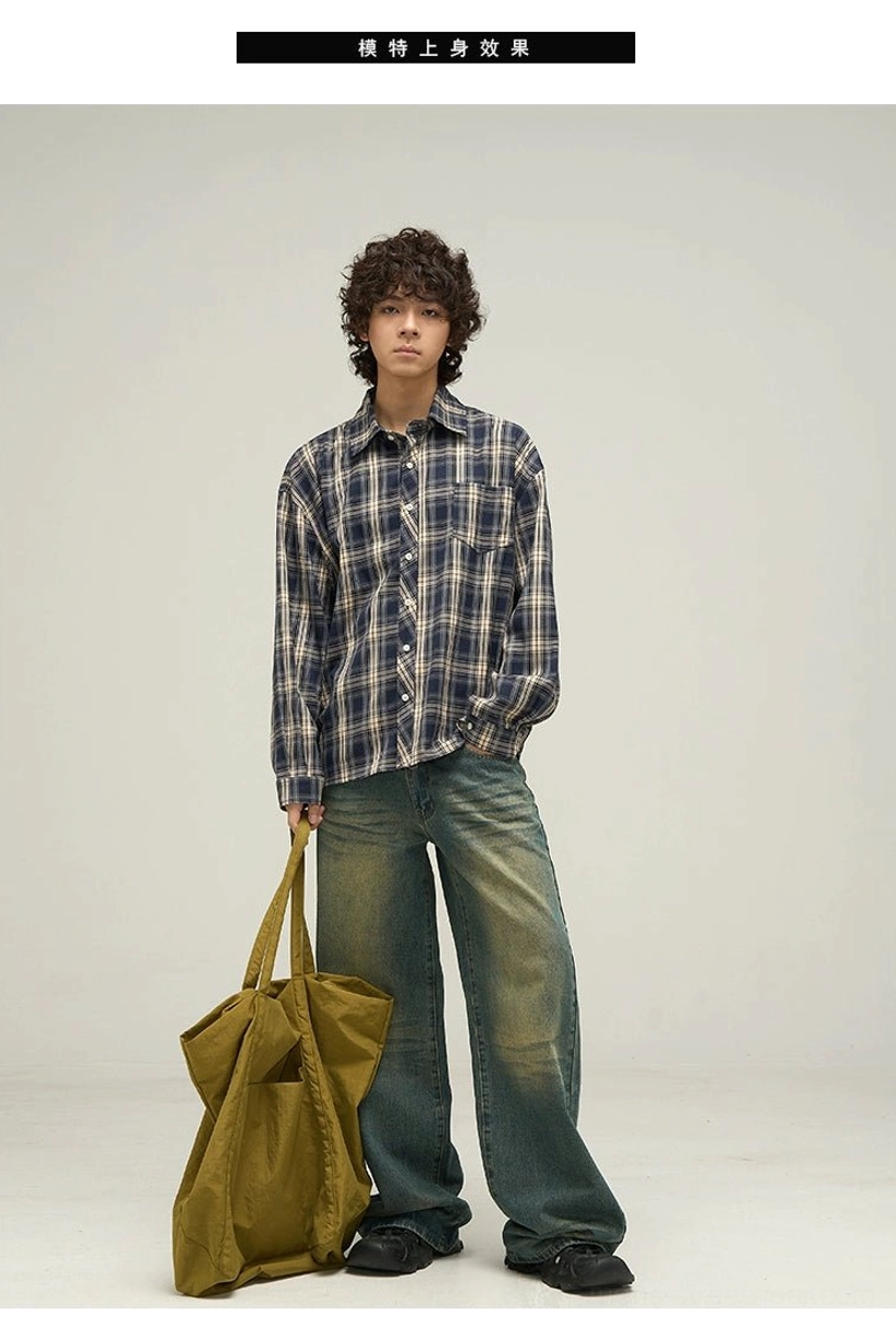 Full front view of oversized navy beige plaid shirt featuring buttoned cuffs chest patch pocket and full button closure