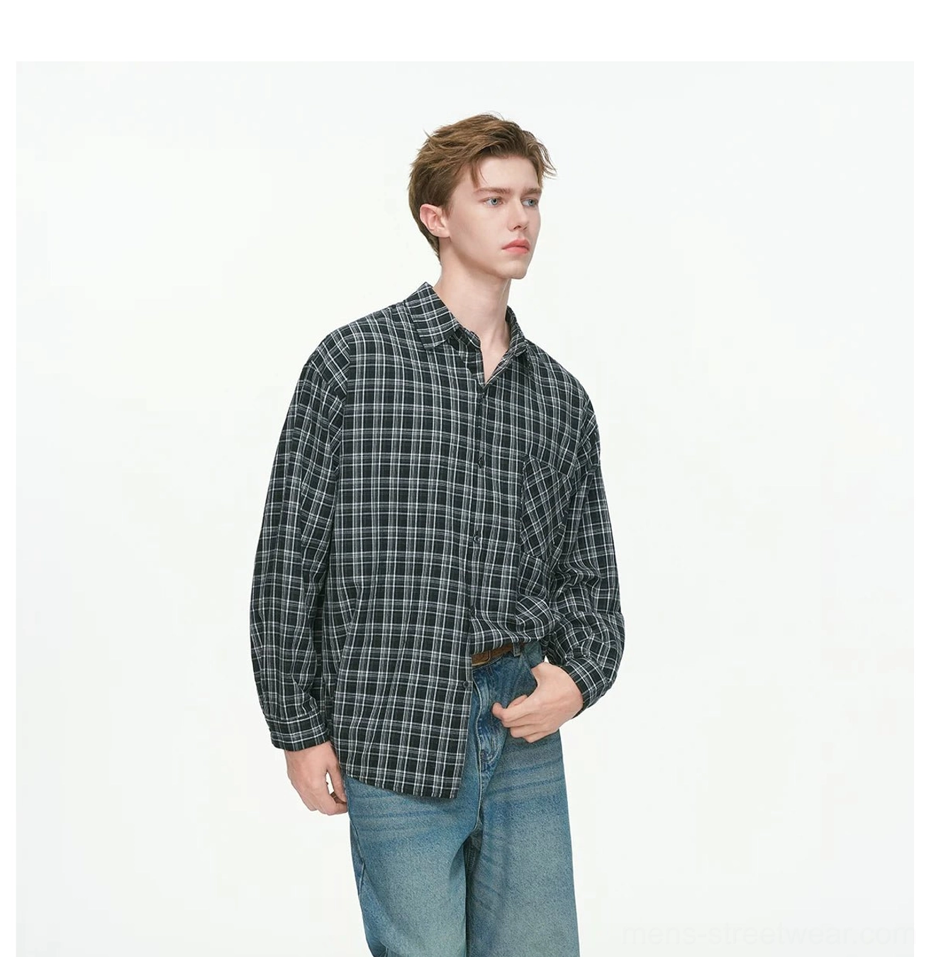 Oversized plaid button-up shirt featuring classic checked fabric spread collar and full button closure